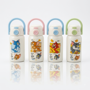 Culinara 500ml Tom and Jerry kids insulated stainless steel water bottle in white with a pastel handle loop, push-button double drink lid, and base reflection on a plain bright white background.
